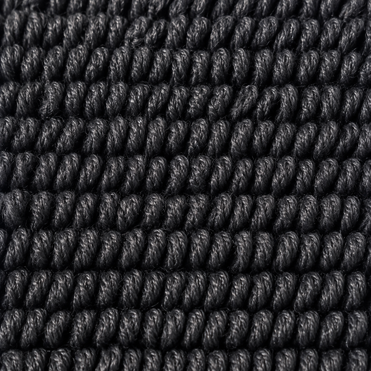 Macro du tissage twisted loop MIRE : boucles fines torsadées, serrées et régulières