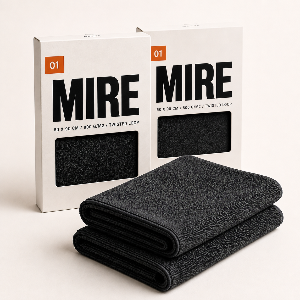 Lot de 2 serviettes MIRE 01 avec leurs deux étuis carton, packshot studio